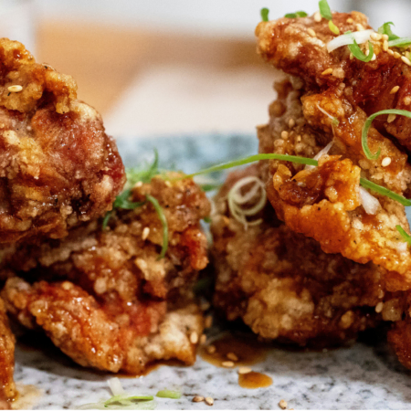 glazed crispy fried chicken with sesame and scallions