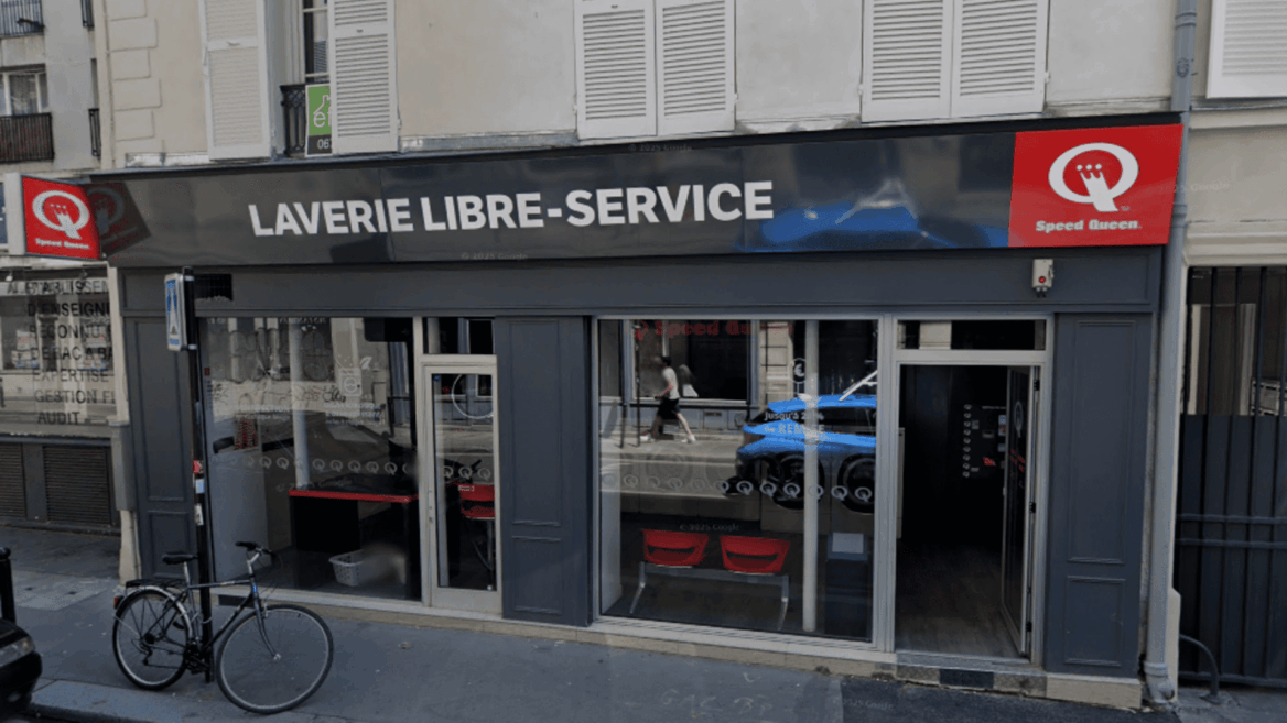 façade de laverie speed queen avec vélo