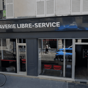 façade de laverie speed queen avec vélo