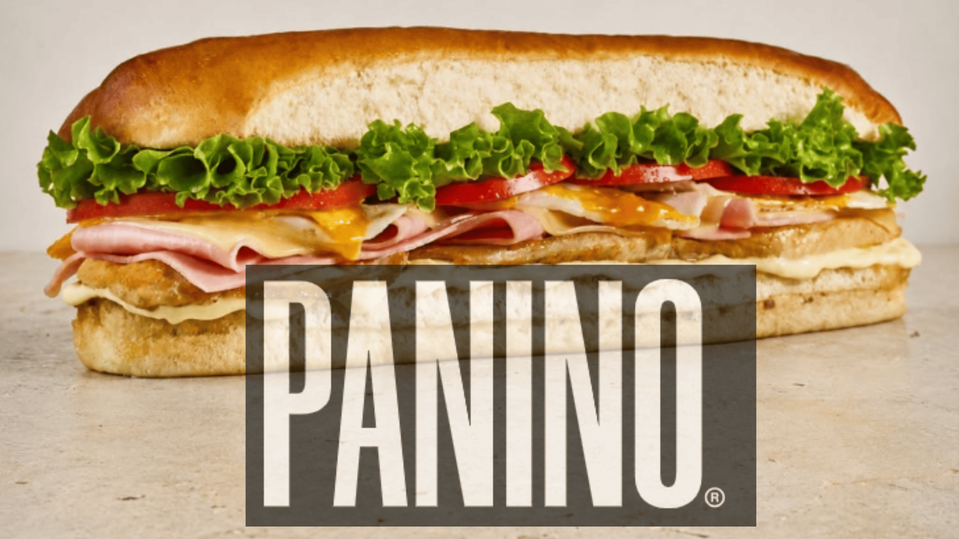 panino gourmet con jamón, queso y tomate