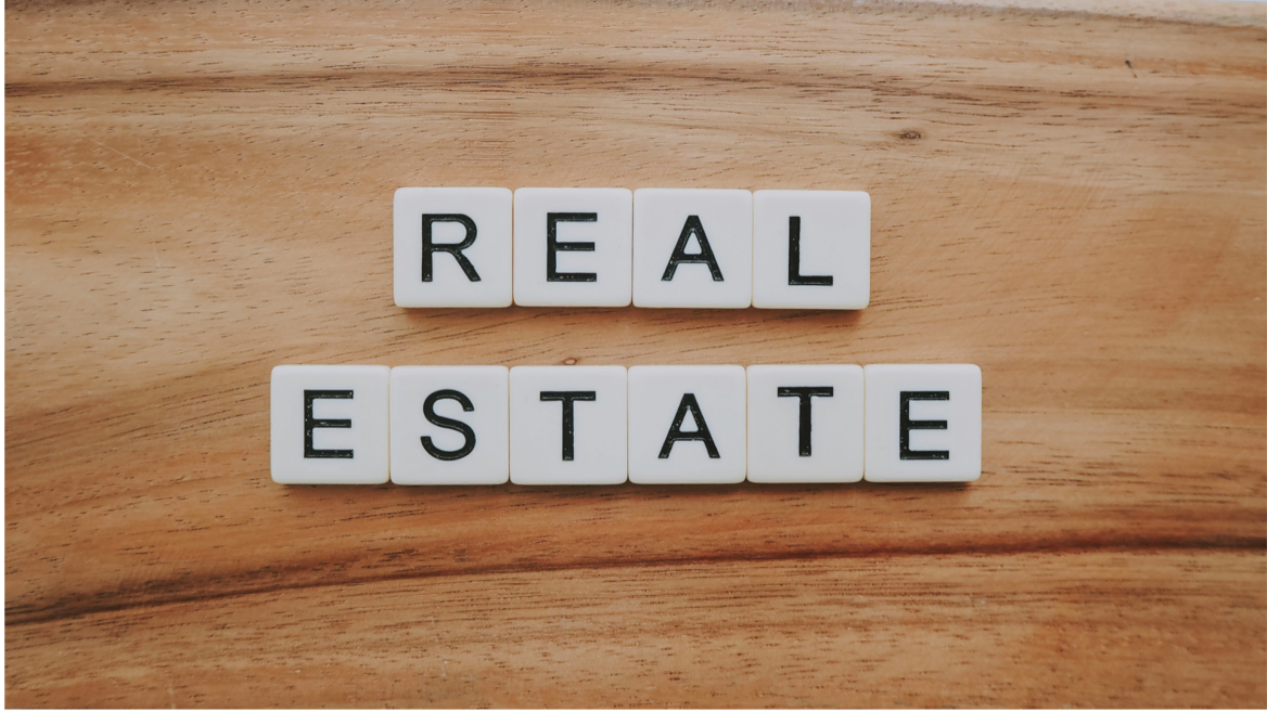 real estate letter tiles on wood