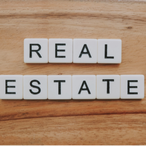 real estate letter tiles on wood