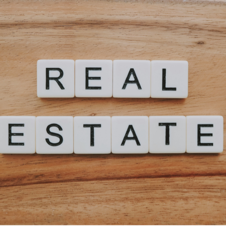 real estate letter tiles on wood