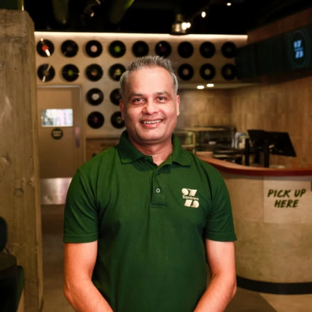 smiling man in modern café interior