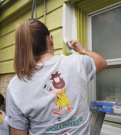 volunteer painting house exterior trim