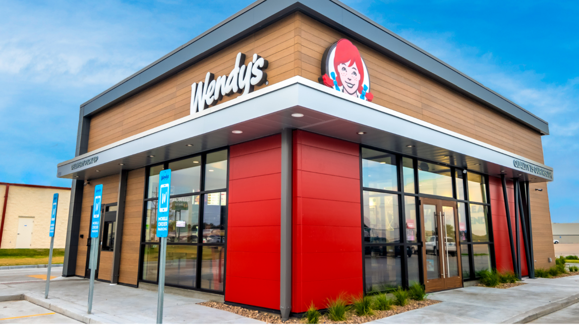 modern wendy’s restaurant exterior with drive thru parking