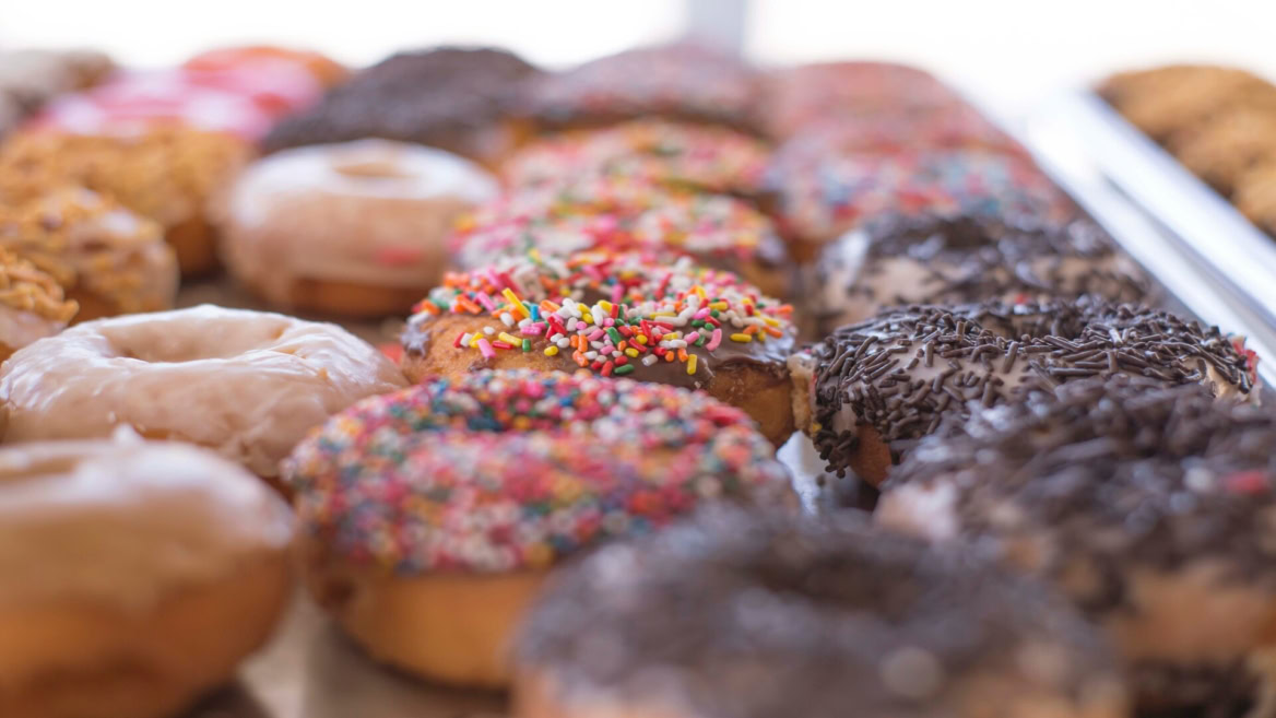 colorful assorted donuts tray close up