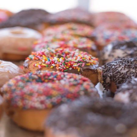colorful assorted donuts tray close up