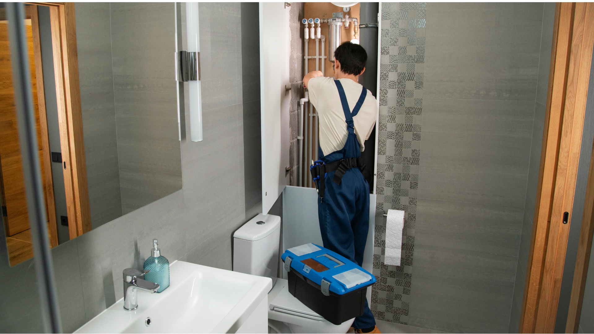 bathroom plumbing repair inspection in modern interior