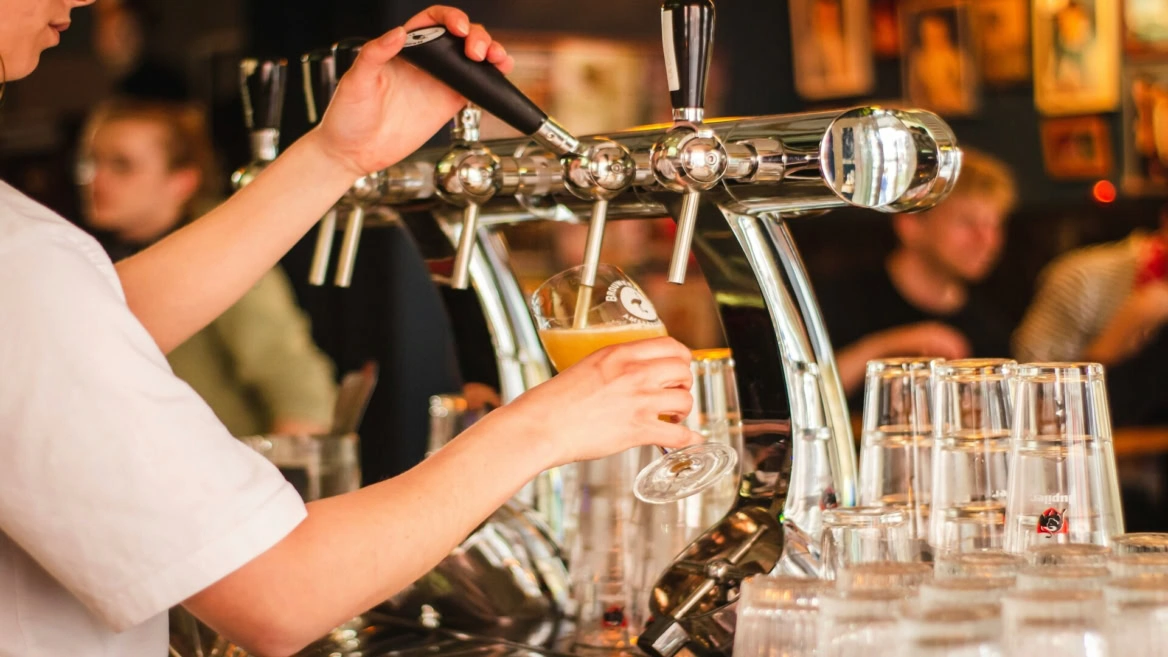 golden beer pour at the pub tap