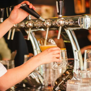 golden beer pour at the pub tap