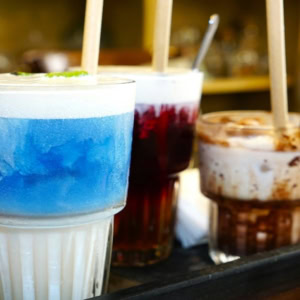 colourful dessert drinks tray in café glasses