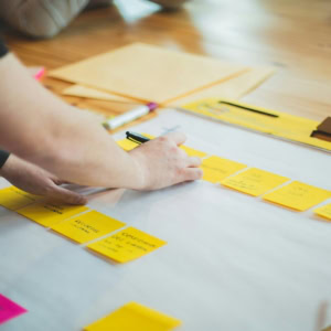 brainstorming session with sticky notes on table