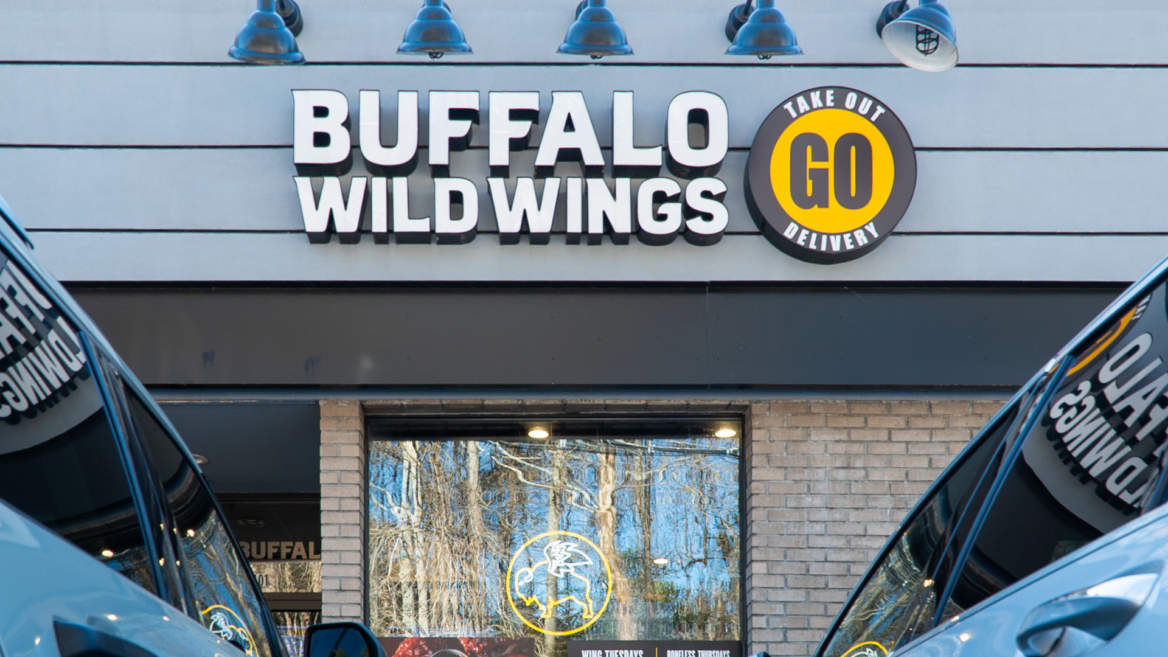 buffalo wild wings storefront with takeout delivery signage