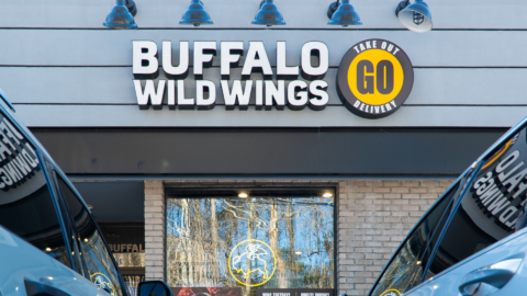 buffalo wild wings storefront with takeout delivery signage
