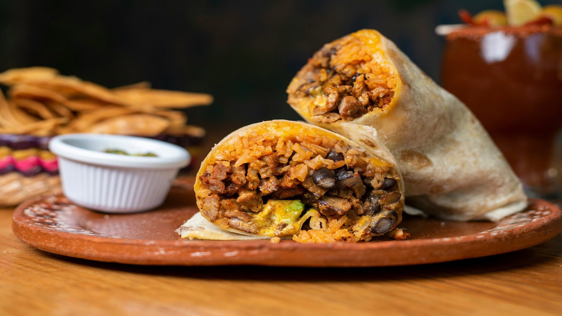 grilled burrito halves on rustic plate