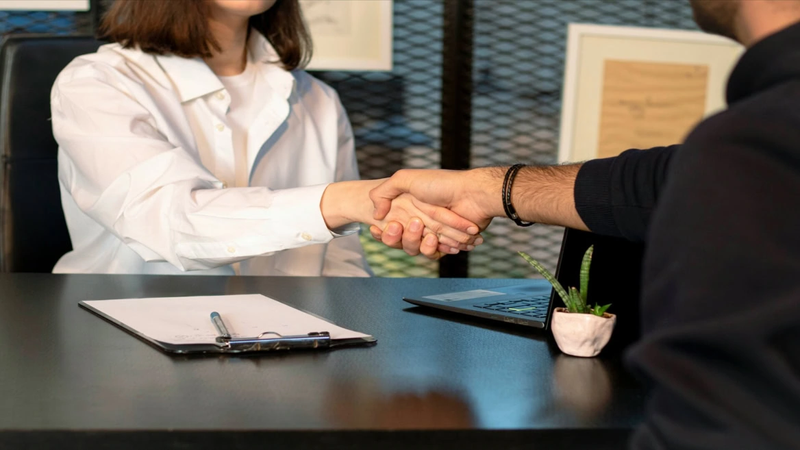 business handshake in modern office meeting