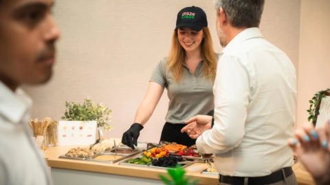 fresh catering buffet with friendly server