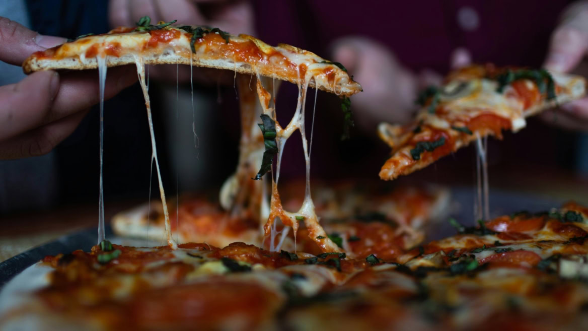 cheesy pizza slice with stretchy mozzarella