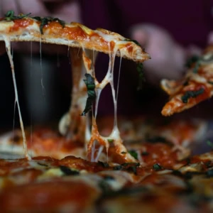 cheesy pizza slice with stretchy mozzarella