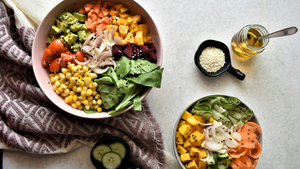 colorful salad bowls with sesame and dressing