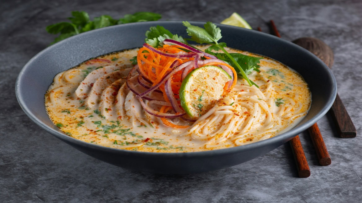 creamy chicken noodle soup with lime and herbs
