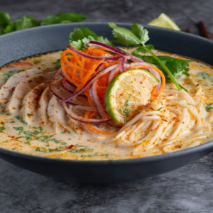 creamy chicken noodle soup with lime and herbs