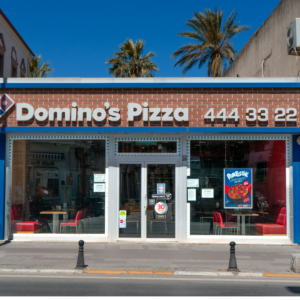 domino’s pizza storefront on sunny urban street