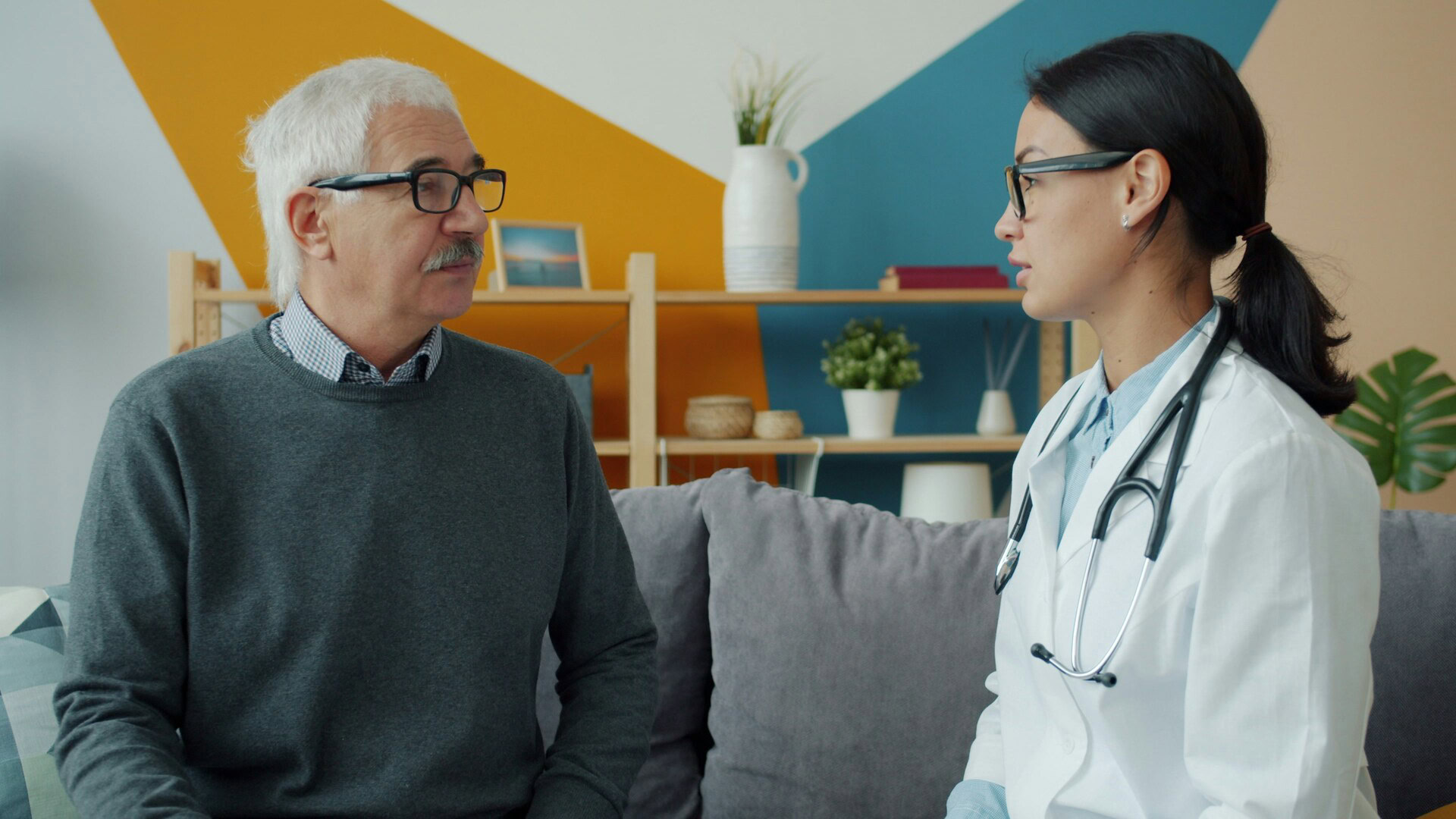 home visit: doctor consulting elderly man