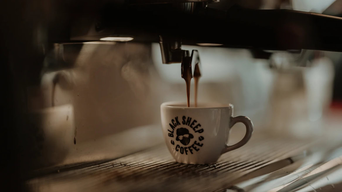 black sheep coffee espresso pouring into cup