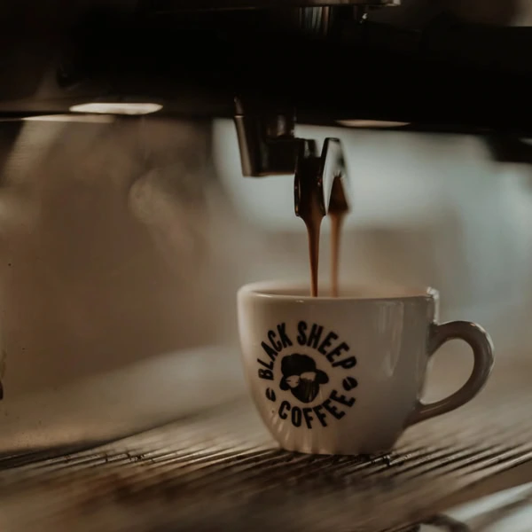 black sheep coffee espresso pouring into cup