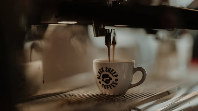 black sheep coffee espresso pouring into cup