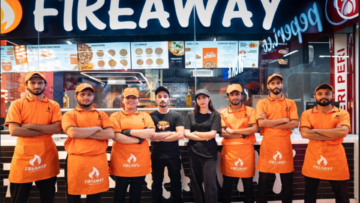 fireaway pizza team poses in orange uniforms