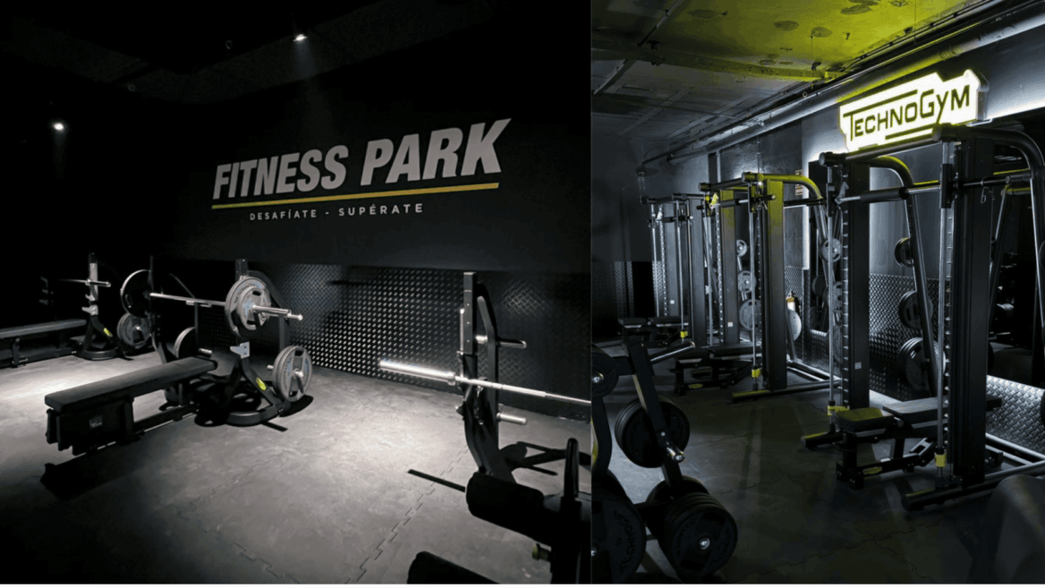gimnasio industrial technogym con pesas y máquinas