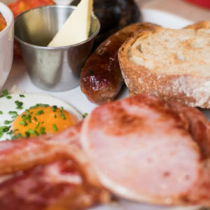 hearty breakfast plate with bacon, egg and toast