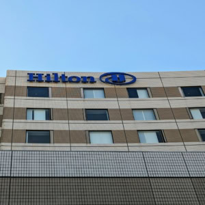 hilton hotel facade with blue logo