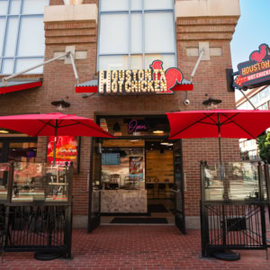 houston tx hot chicken restaurant exterior with red umbrellas
