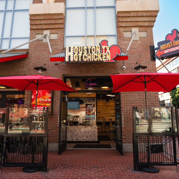 houston tx hot chicken restaurant exterior with red umbrellas