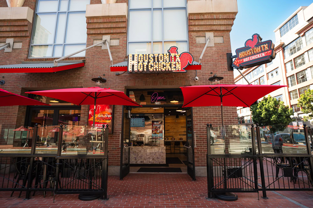 houston tx hot chicken restaurant exterior with red umbrellas