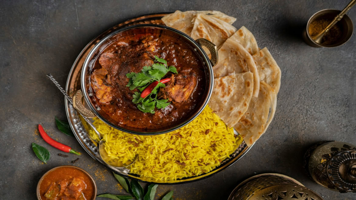 indian curry, saffron rice and naan feast