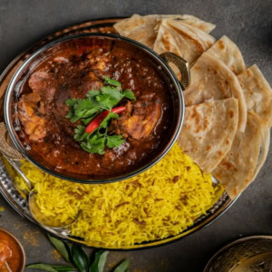 indian curry, saffron rice and naan feast