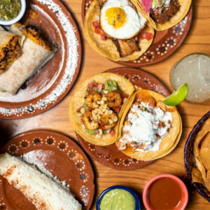 colorful mexican feast with tacos and burrito