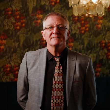 middle aged man formal portrait in patterned tie