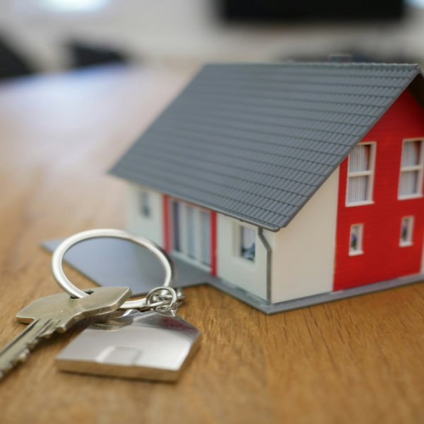 mini house and keys for new home purchase