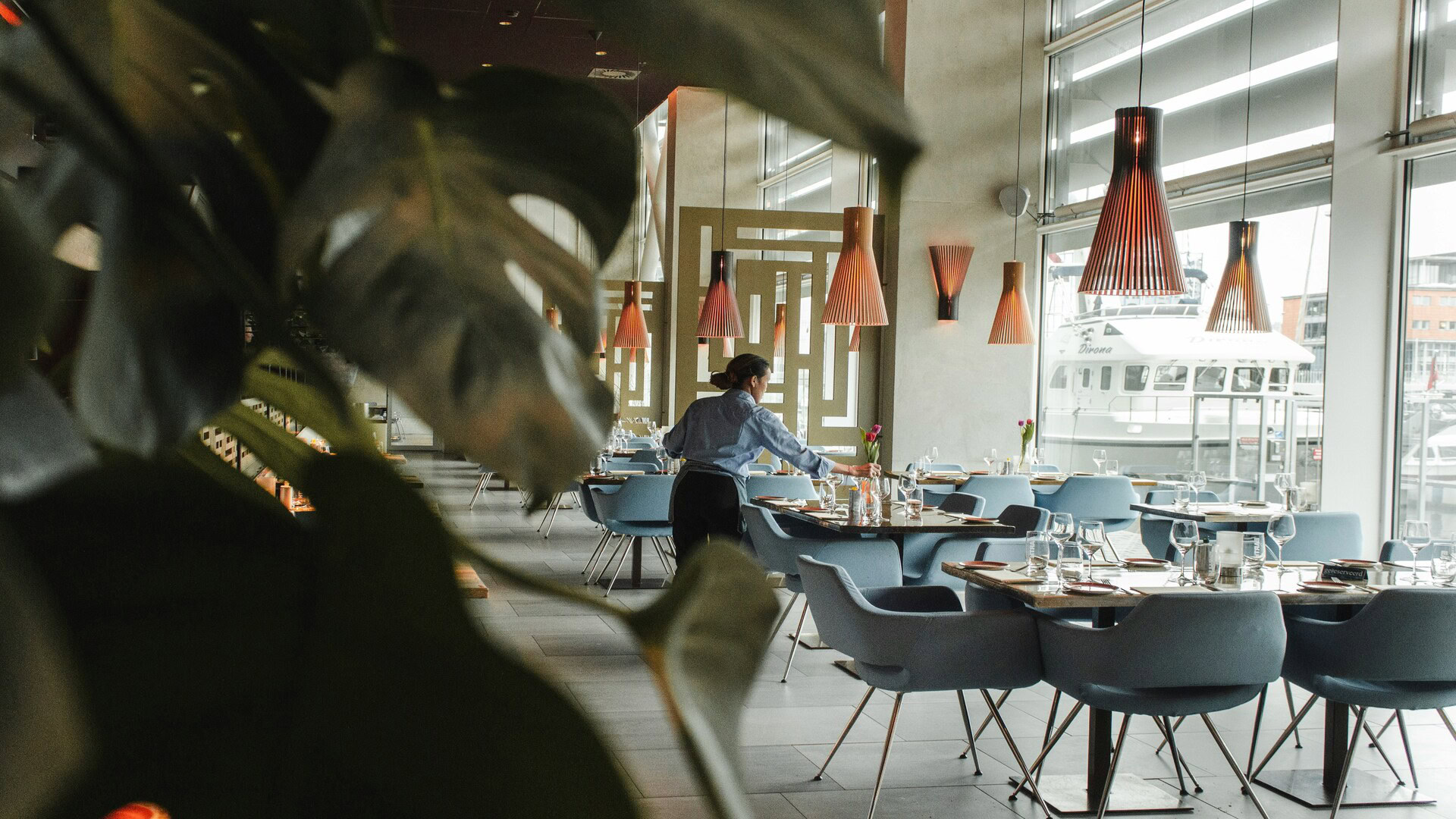 elegant waterfront restaurant interior with harbour view