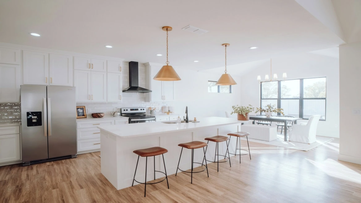 modern white kitchen with dining area