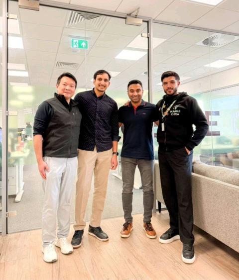 friendly office team portrait of four men