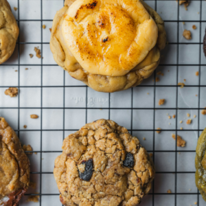 assorted gourmet cookies on cooling rack
