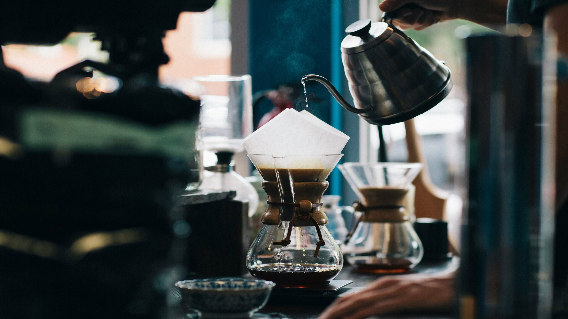 pour over coffee brewing in glass dripper