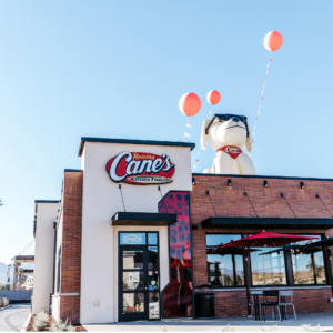 raising cane’s restaurant with inflatable mascot